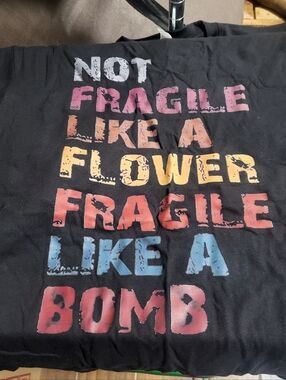 Womens Black T-shirt "Not Fragile Like a Flower Not Fragile Like a Bomb" Size L